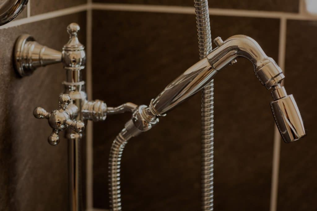High Sierra Showerheads' close-up photo of chrome Handheld on ADA Slide Bar. Made for Home and Hospitality.